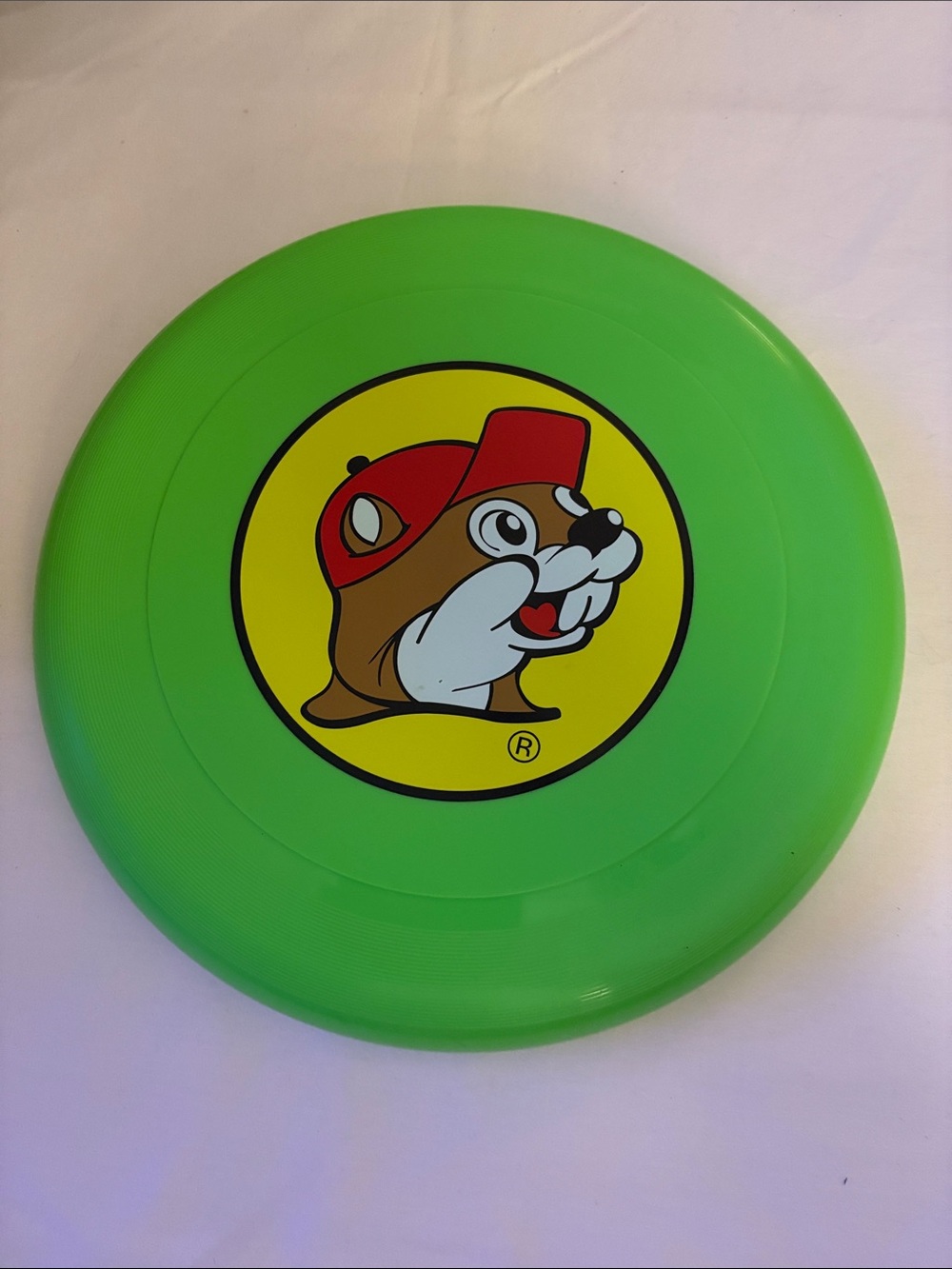BUC-EES Bright Green Frisbee with Cheerful Beaver Logo.